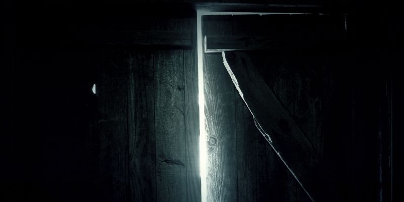 creepy door opening with light shining through