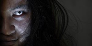 haunted girl with white irises