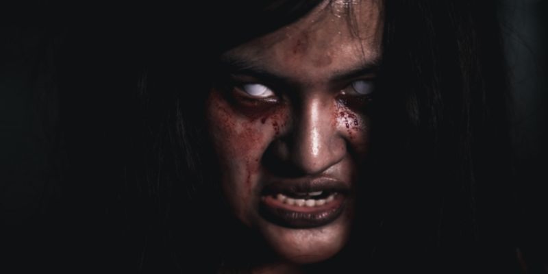 demon girl with white-out eyes and blood streaming from eyes