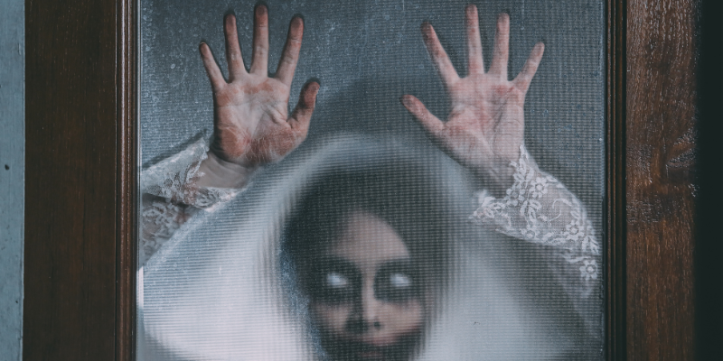 Ghost bride clinging to door 