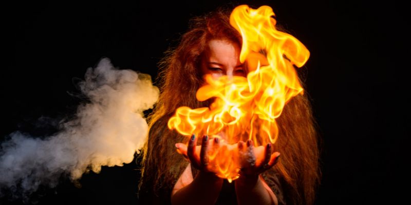 woman holding ball of fire