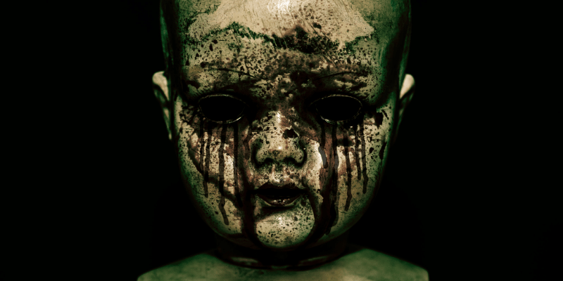 creepy bloody doll in the dark