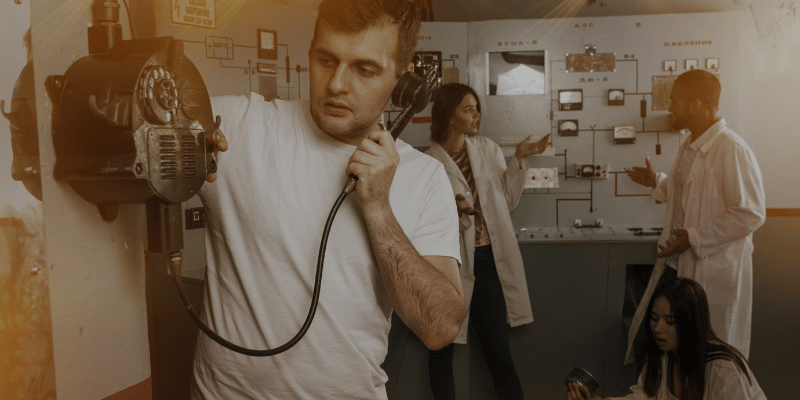 group of people playing an escape room game