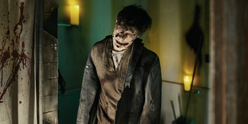 Scary Walking Corpse in Interior of Blood-Splattered Bathroom