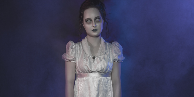 Ghost woman in a white Victorian dress, Halloween scene