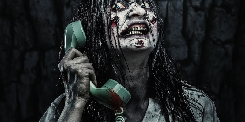 Horror zombie girl calling by phone