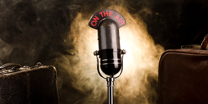 Vintage Radio Microphone on Old Suitcase, Dramatic Lighting and Smokey Background