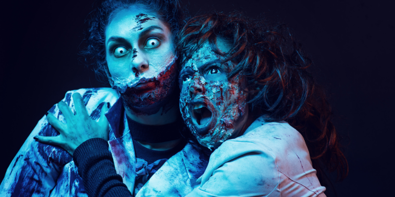 Zombies looking scary against a black background