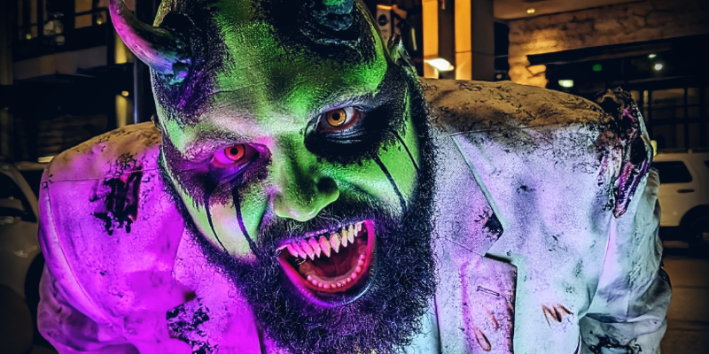 Murve Slimesworth eyeing your from behind the camera in a dark scene with purple lighting