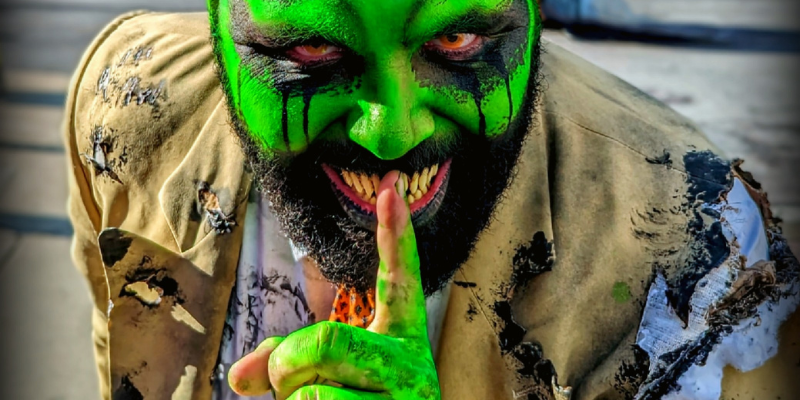 Murve Slimesworth putting a finger in front of his mouth telling secrets
